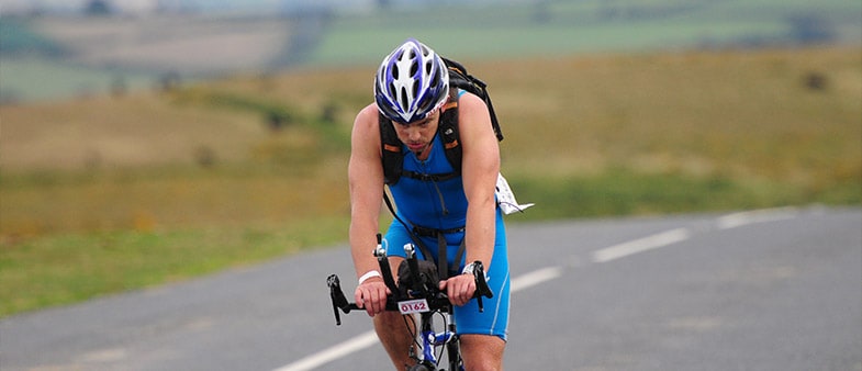 Andy Ridout cycling through his Ironman