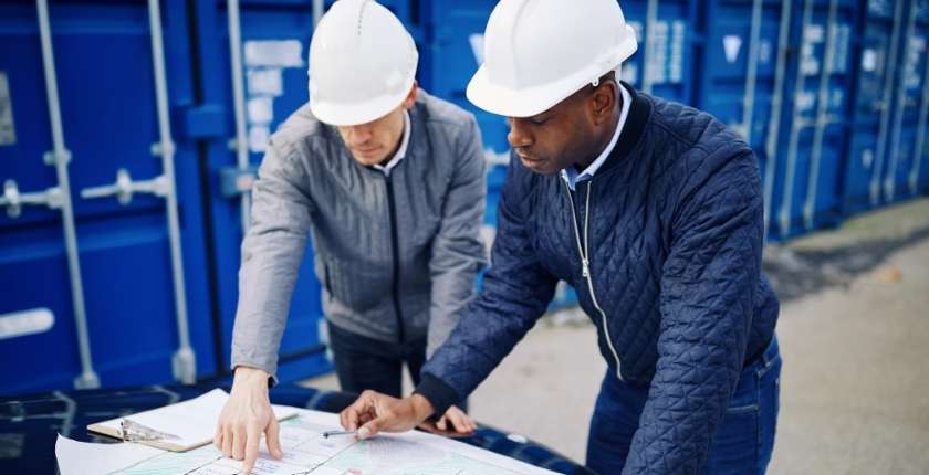 Engineers looking at plans