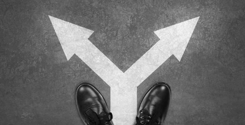 Business Man Choosing the path contract or permanent roles